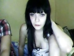 Two naughty dark haired webcam lesbos undress and tease titties
