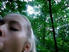 Hot blonde blows her boyfriend in the woods