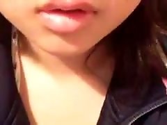 Cute amateur Asian webcam girlie brags of her kissable lips